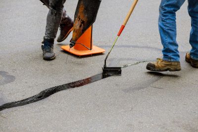 Maintain the Strength and Integrity of the Asphalt with Crack Filling Service!